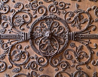 Gothic wrought-iron spreading scrolls with flowers on a door of Notre Dame de Paris, unknown architect or blacksmith, 12th or 13th centuries