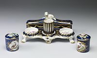 Porcelain inkstand set, 1759–1769. The style and the "mazarine blue" ground are borrowed from Sèvres. The Walters Art Museum.