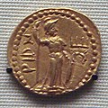 Coin of Huvishka 126–163, with Kushan goddess Rishti, possibly depicted as Roma copied from a Roman coin.[26][27][28]