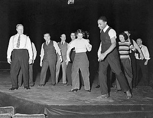 Clarence Yates (foreground) rehearsing cast members at Maxine Elliott's Theatre