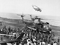 Evacuees offloaded onto USS Midway