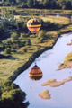A hot air balloon over a river in Québec.