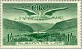 One shilling Irish stamp with Vox Hiberniae flying over Gleann Dá Loċ (1949)