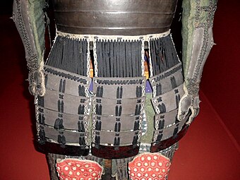 Antique Japanese samurai Edo period kusazuri, lacquered iron or leather panels which hang from the bottom of the chest armor dou.
