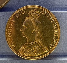 A gold coin with a profile of Queen Victoria, wearing a small, round-top crown, facing left