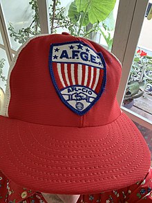 Red, white, and blue baseball cap with logo of the American Federation of Government Employees