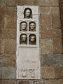 An ancient Roman stele on the facade of Porta Nuova.