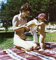At the Herzsprung naturist FKK lake park in Brandenburg state, Germany; one of the most popular FKK bathing parks in the Angermünde district. Here the workers in long and prolonged labour of the Angermünde district works for agricultural technology created a leisure and recreation centre for everyone (photo dated August 1983).
