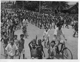 Japanese prisoners of war being marched through the streets of George Town on 3 September 1945