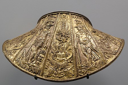 A dosseret or back plate for protecting the back of the neck, with figures of Mars and Minerva (end of 16th century)