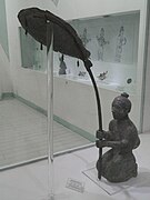 Dian servant with a parasol