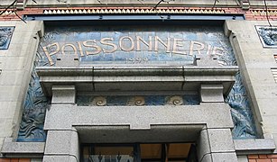 Entry to the former fish market at Les Halles Centrales, south of La Vilaine, from 1922. Now a contemporary art museum.