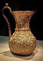 Gold ewer of the Buyid Period, mentioning Buyid ruler Izz al-Dawla Bakhtiyar ibn Mu'izz al-Dawla, 966-977 CE, Iran.[167]