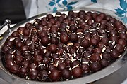 Gulab jamun with almond pieces
