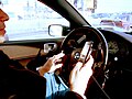 Image 55A driver using two handheld mobile phones at once (from Mobile phone)
