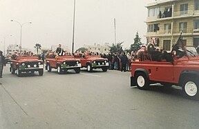 Mourners line up along Zahran street in Amman on 8 February 1999 as royal motorcade transports King's coffin