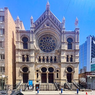 The Eldridge Street Synagogue's west facade seen on a sunny day in 2022