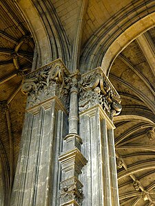 A blend of Renaissance classicism (the Corinthian column capitals) and Gothic (the vaults)