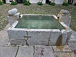 The water basin and fountain at the center of the courtyard