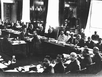 British prime minister, Ramsay MacDonald, three places to the right of Gandhi (to the viewer's left) at the 2nd Round Table Conference. Samuel Hoare is two places to Gandhi's right. Foreground, fourth from left, is B. R. Ambedkar representing the "Depressed Classes".
