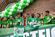 Asamoah celebrating Greuther Fürth's historical promotion in Bundesliga with his team-mates and head coach Mike Büskens in April 2012.