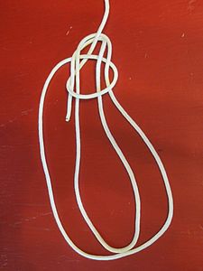 Two-loop Birmingham bowline before tightening and dressing the knot. Two turns taken around the standing part of the line form two loops.