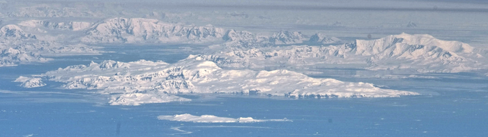 Brabant Island seen from northeast, with Hoseason Island and Liège Island in the foreground, and Anvers Island (on the right) and Antarctic Peninsula in the background.