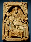 English alabaster with Mary in a bed, attended by a midwife