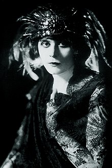 Black and white photo Theda Bara wearing a feathered headdress