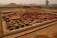Landscape of Vikramashila university ruins, the seating, and meditation area. It was one of the most important centers of learning, during the Pala Empire, established by Emperor Dharmapala. Atiśa, the renowned pandita, is sometimes listed as a notable abbot.[91]