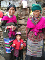 Pilgrims or locals at Drepung Monastery, wearing Ü-Tsang chubas.