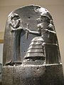 The only other surviving large image from the time: top part of the Code of Hammurabi, c. 1760 BCE. Hammurabi before the sun-god Shamash. Note the four-tiered, horned headdress, the rod-and-ring symbol and the mountain-range pattern beneath Shamash' feet. Black basalt. Louvre, Sb 8.
