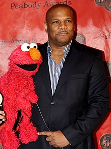 Kevin Clash holding Elmo at the 2010 Peabody Awards lunch