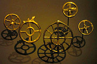Wheel pendants dating to the second half of the 2nd millennium BC, found in Zürich. Variants include a six-spoked wheel, a central empty circle, and a second circle with twelve spokes surrounding one of four spokes.