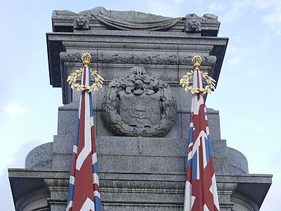 Northeast flags and carved wreath enclosing the arms of Rochdale