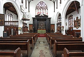 A church interior looking towards the altar and east window
