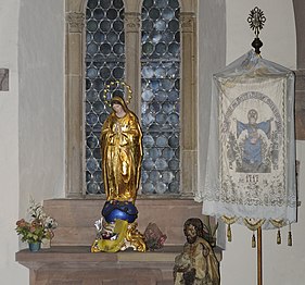 Statue of Virgin and a processional banner, in the Chapel of St. Andrew