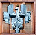 Polish coat of arms (unofficial) in Art Deco style, on the facade of the post office in Warsaw (architect Julian Puterman-Sadłowski 1934).
