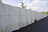 White granite wall with engraved names