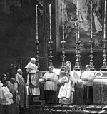 Pope Pius X (left) wearing the papal vestments at the episcopal consecration of Giacomo della Chiesa (later Benedict XV)