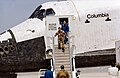 Crew of STS-1 exit Space Shuttle Columbia after landing