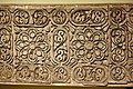 Carved stucco panel from the city of Samarra. Floral pattern with Abbasid geometric designs, grapes, vines, and ears of pine cones. third Islamic century AH (9th century)