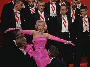 Pink combined with black or violet is associated with seduction. Marilyn Monroe in the trailer for the film Gentlemen Prefer Blondes (1953).