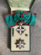 The Grand Cross grade of the Order in case of issue