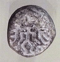 Terracotta stamp seal with Master of Animals motif, Tell Telloh, ancient Girsu, End of Ubaid period, c. 4000 BC [17][18]
