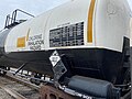 Image 29Trains carrying hazardous materials display information identifying their cargo and hazards. This tank car carrying chlorine displays, among other markings, a U.S. DOT placard showing a UN number that identifies the hazardous substance. (from Train)