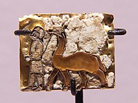 Votive plaque in cloisonné with man leading a camel, Temple of the Oxus, Takht-i Sangin, 6th-5th century BC
