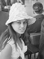 Beauty queen and actress Aliza Gur wearing a flared lampshade hat with textured pattern in 1964