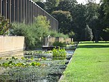 A view of the water garden along the west side of the site, toward the small bridge that was part of the original entrance sequence.