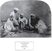Ethnographic photograph of Jat zemindars (land owners) in Rajasthan, playing pachisi, 1874.
